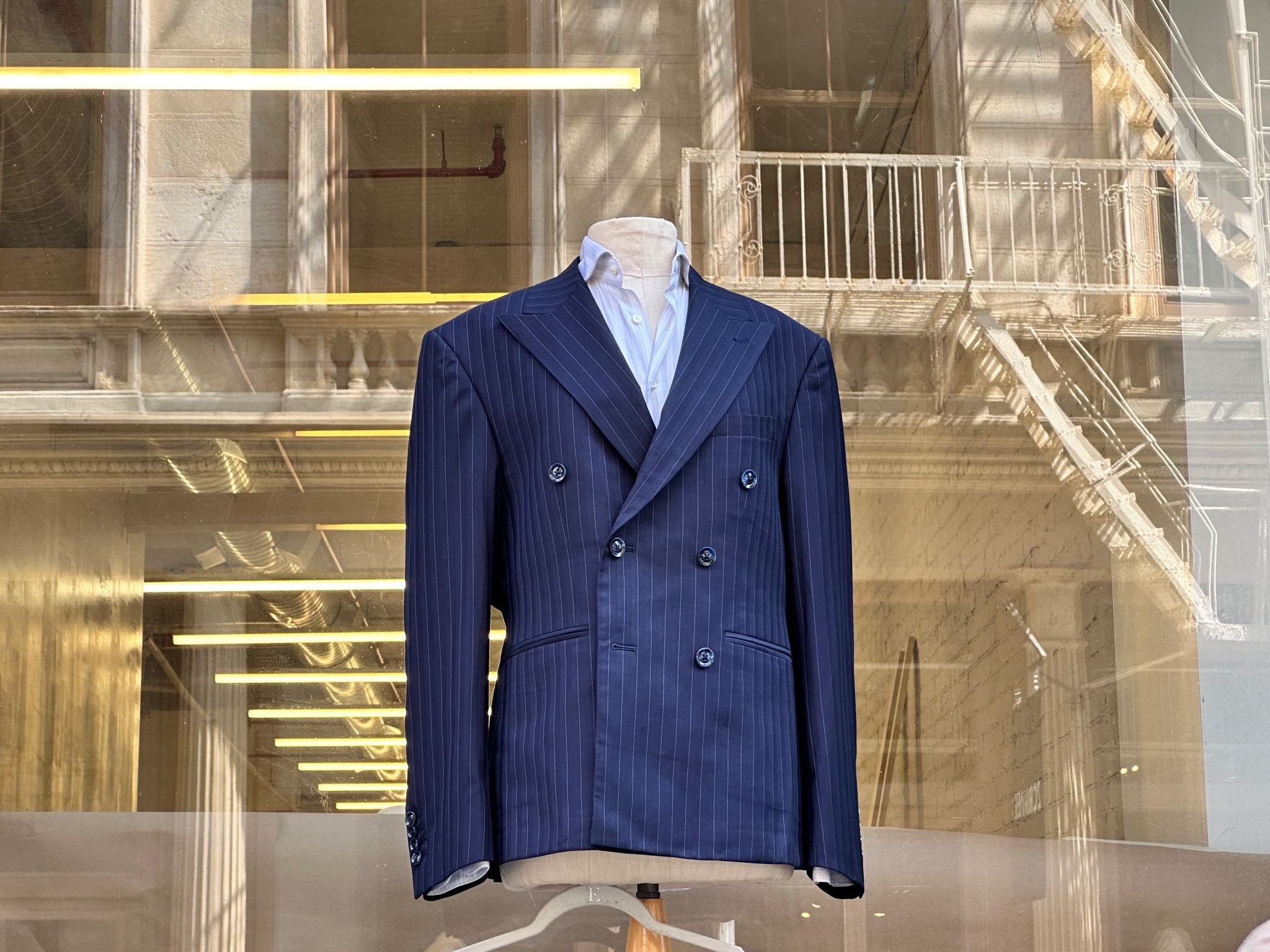 Double-breasted suit in window